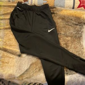 Nike child’s large slim black sweatpants.